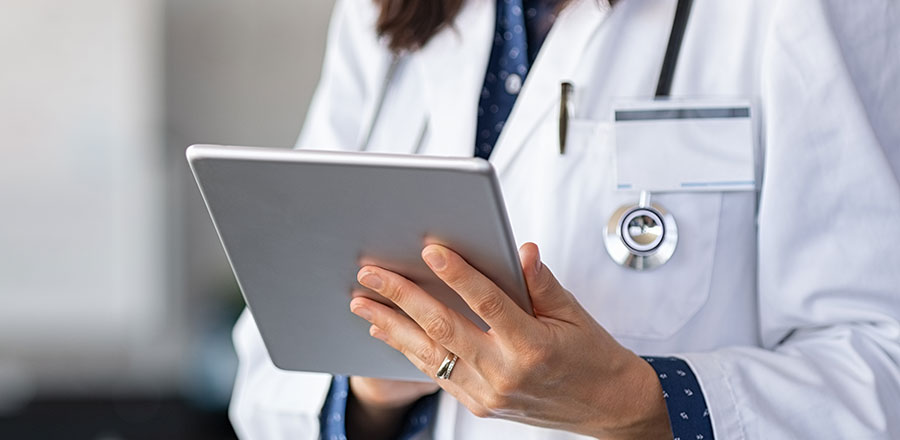 Doctor on Tablet