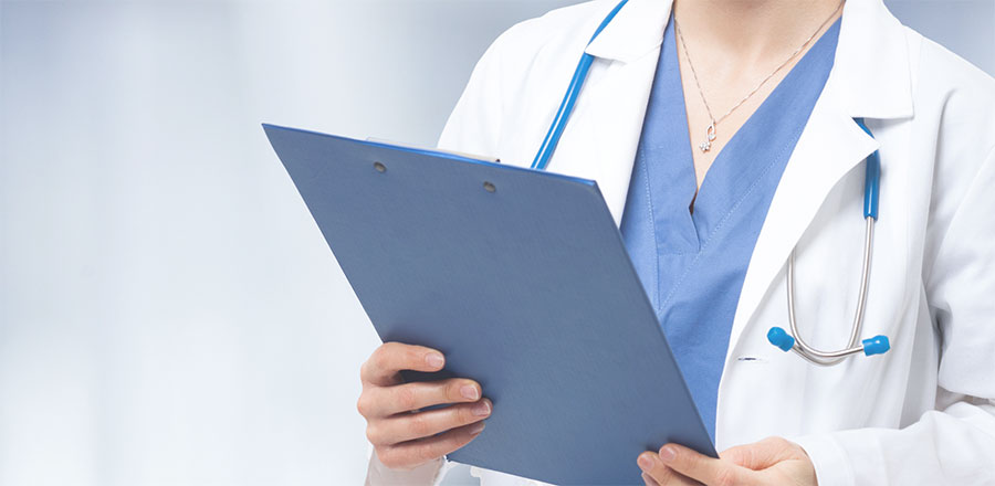 Doctor holding clip board